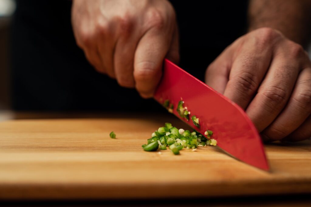 a person chopping vegetable